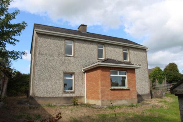 The two-storey farmhouse which is included in lot 3.